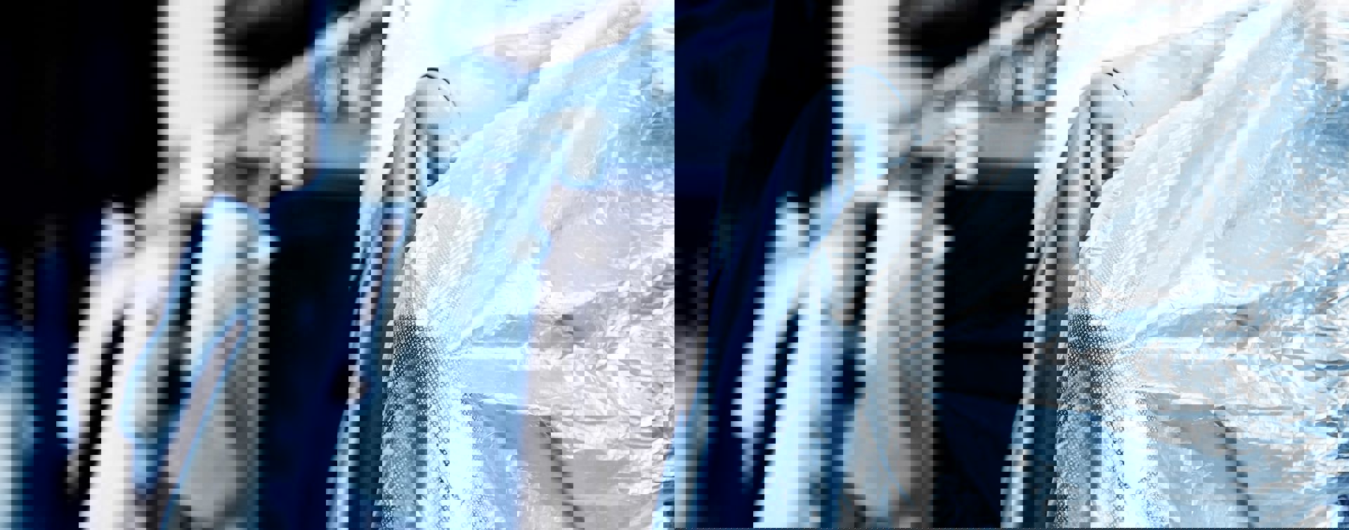 Dry Cleaned Suits Hanging Min